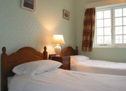 [Image: A double room at the Royal Norfolk and Suffolk Yacht Club]